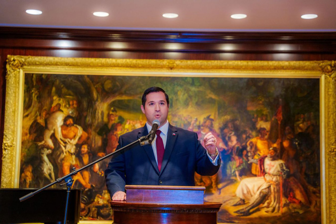 Matthew Kolodoski speaking at podium